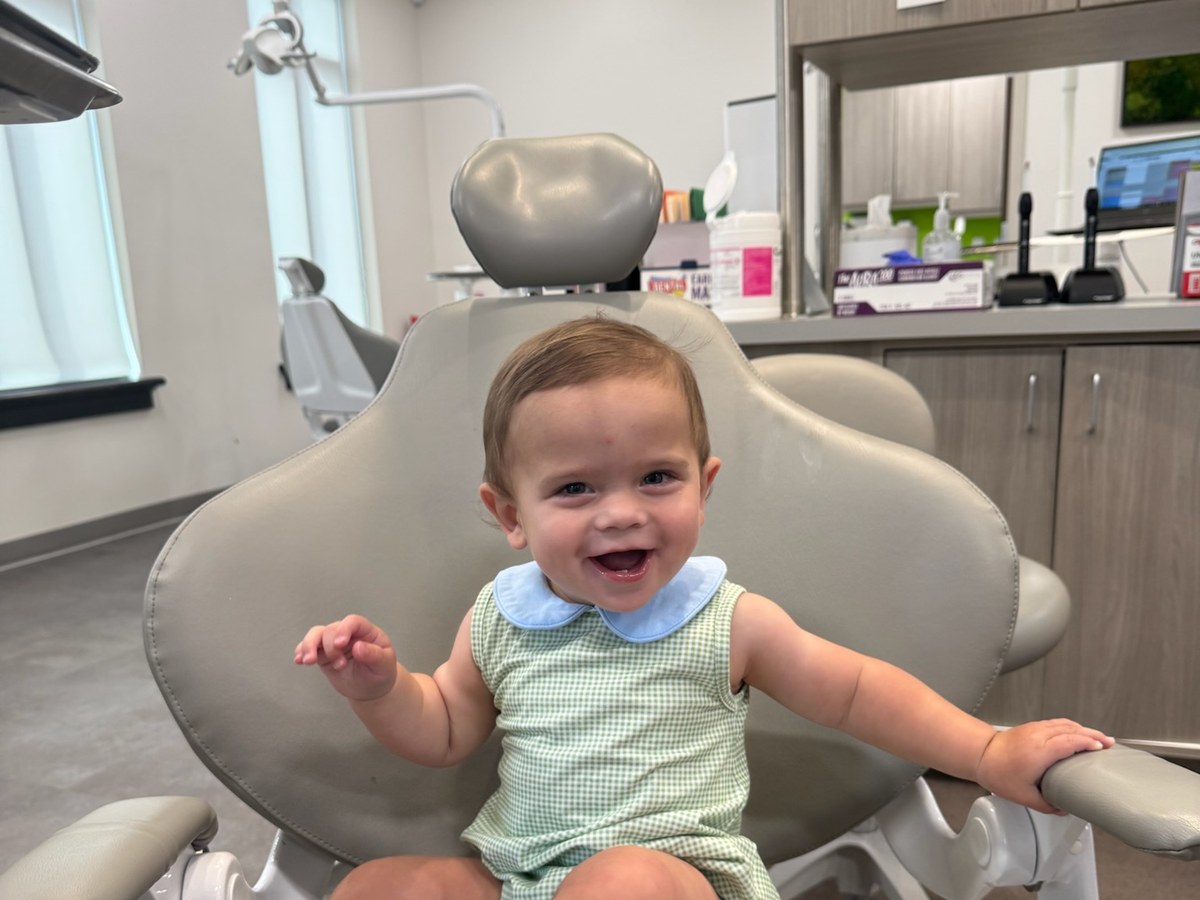 Young patient smiling in the dental chair