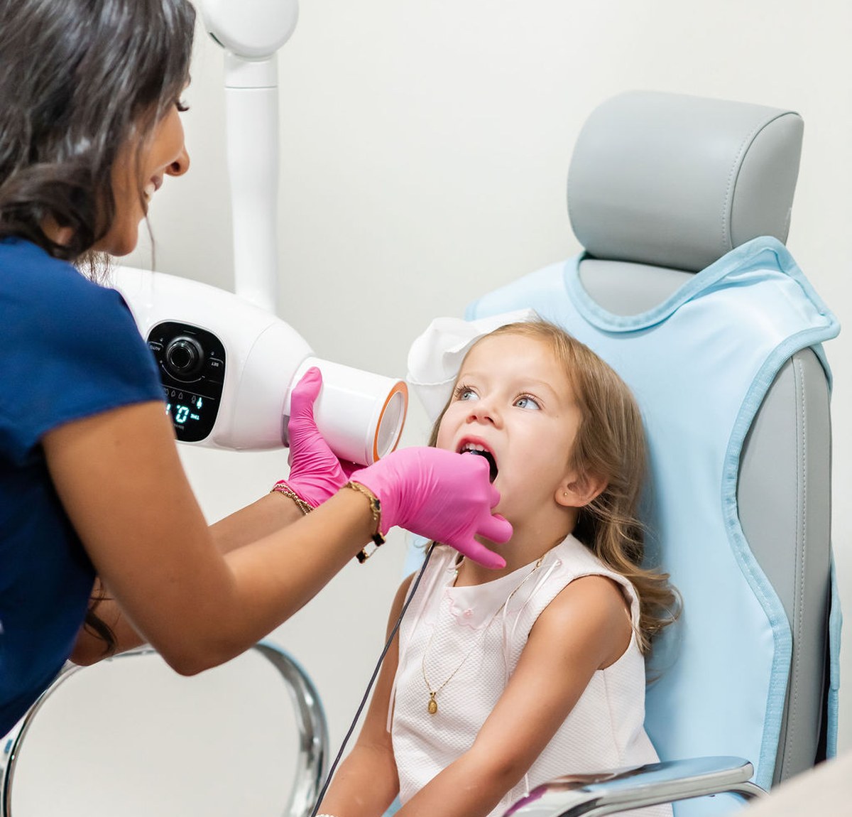 Dentist examining an infant patient