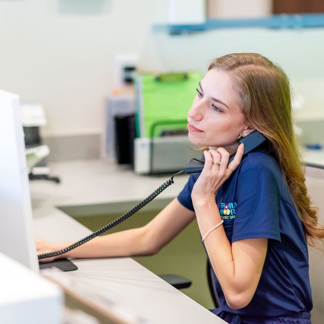 Team member at the Thomas & Moore front desk