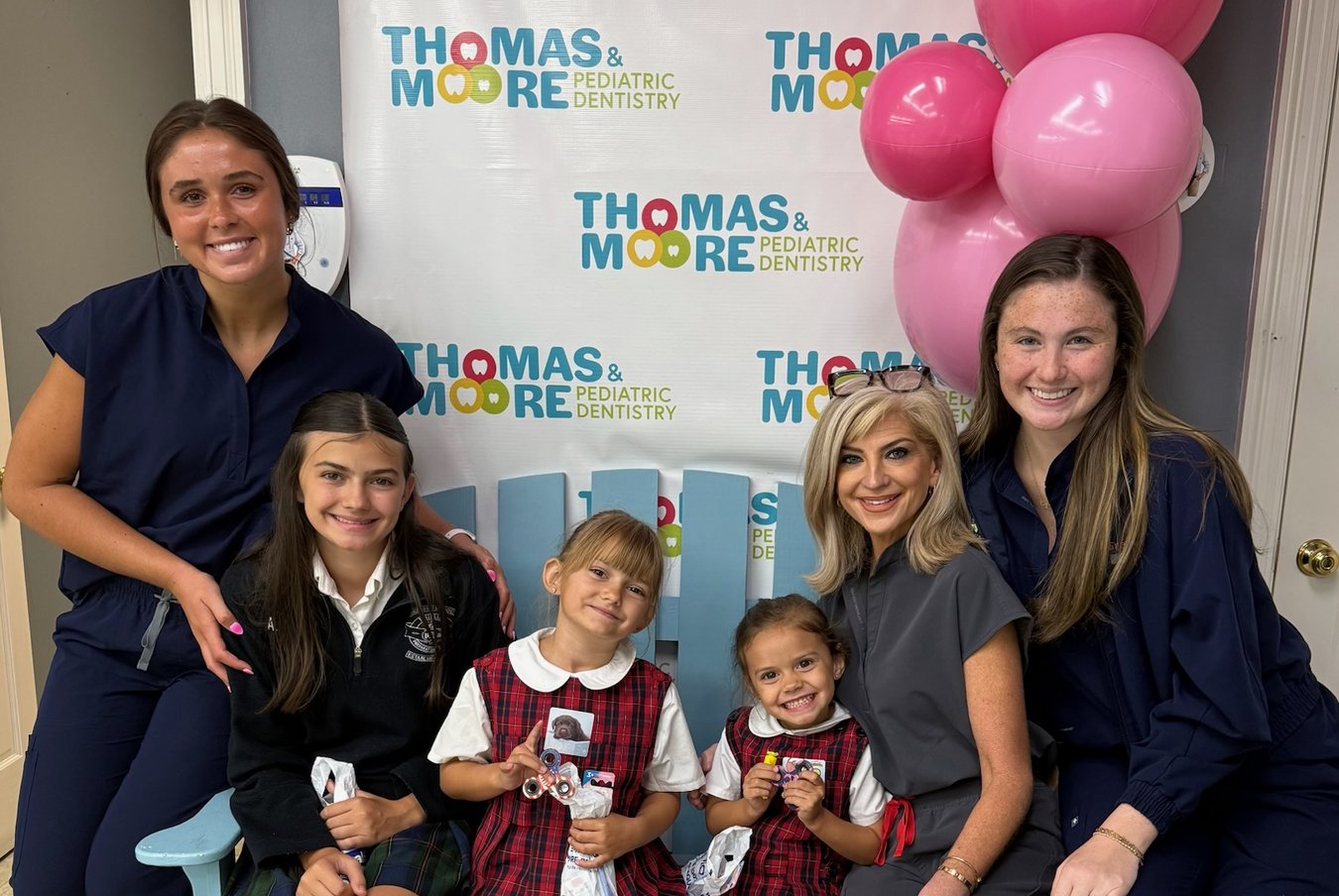 Thomas & Moore Pediatric Dentistry team members with young patients