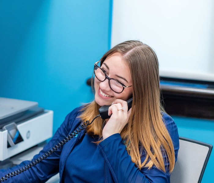 Team member answering the phone at Thomas & Moore