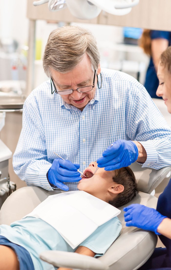 Dr. Thomas examining a young patient
